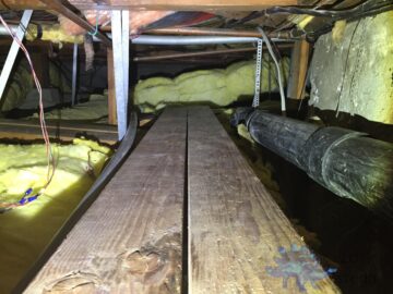 Section of messy crawlspace