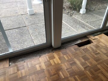 Leak-damaged floorboards