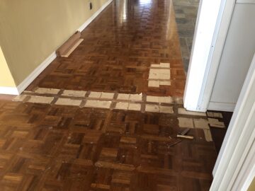 Laying replacement parquet over repaired floor